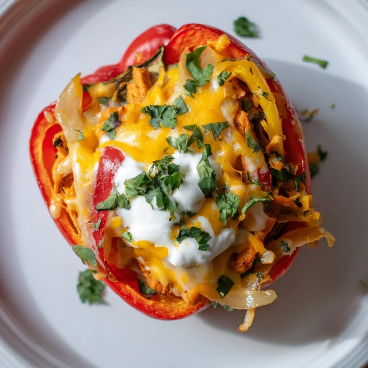 Tex-Mex Chicken Fajita Stuffed Peppers garnished with cilantro and a lime wedge for a bright, zesty flavor.