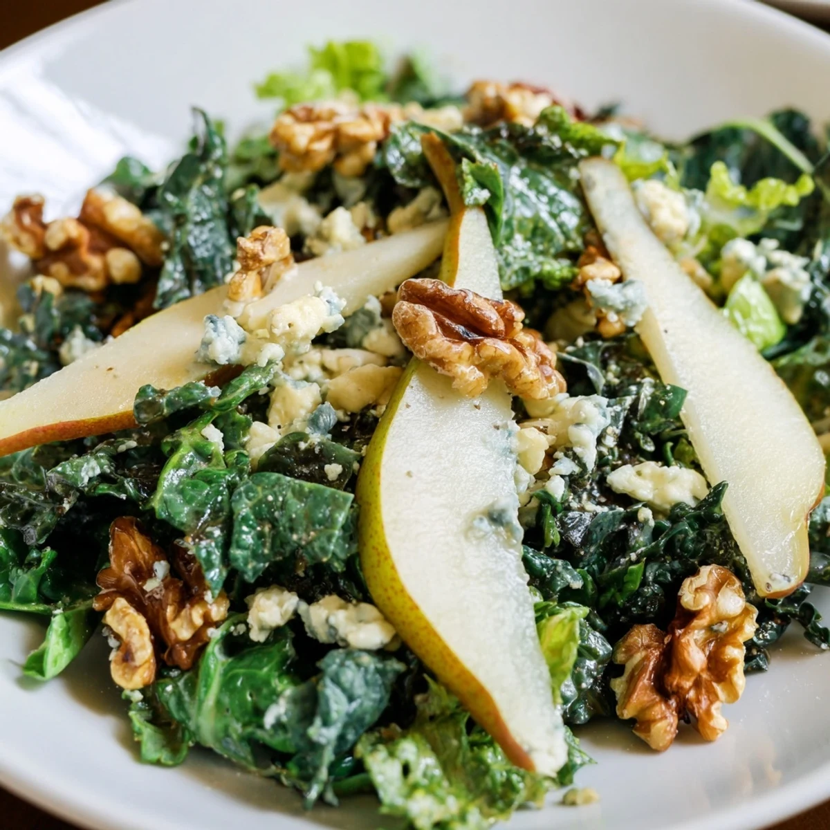 Sliced ripe pears atop a bed of crisp winter greens with tangy vinaigrette and blue cheese crumbles.