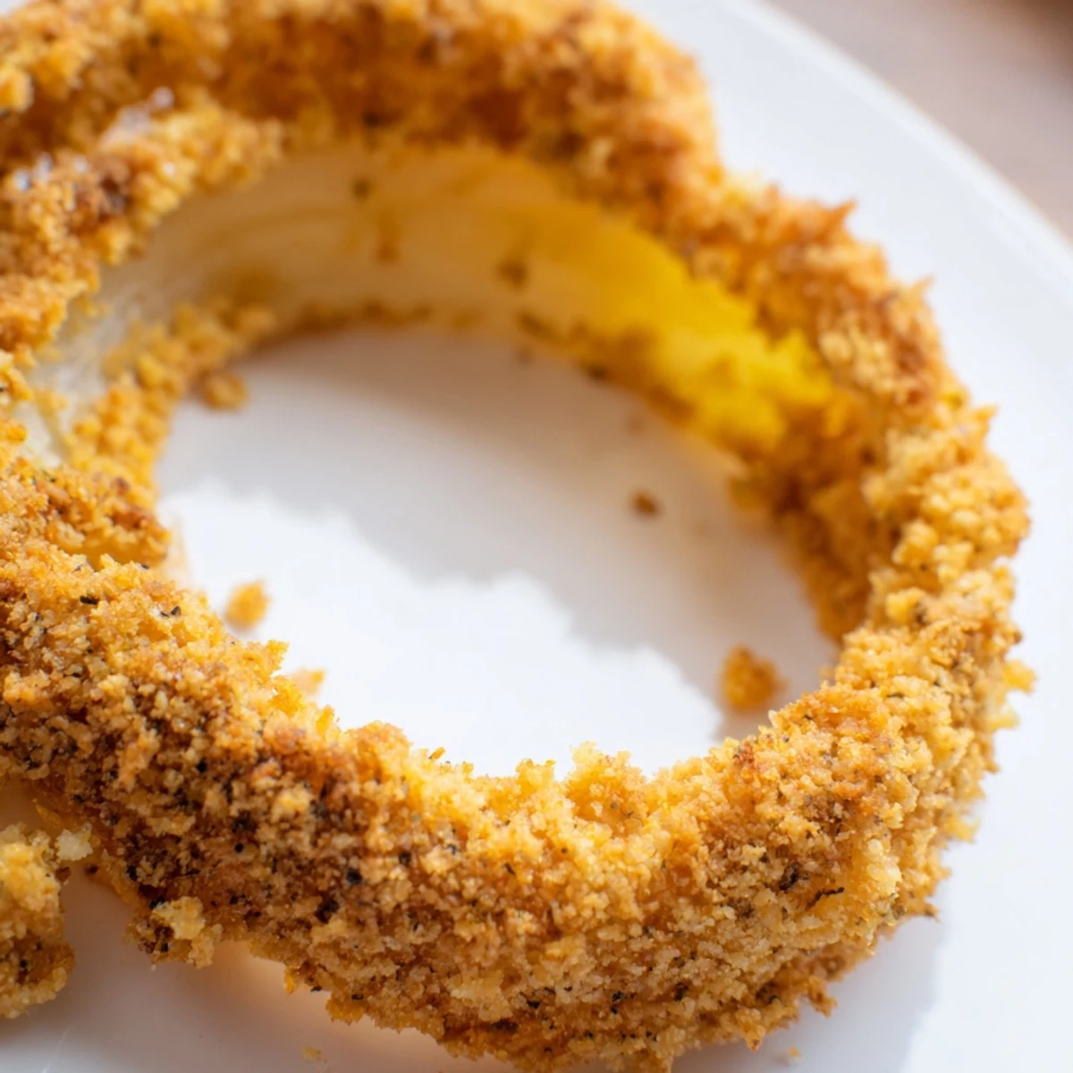 Crispy baked onion rings, golden brown and seasoned with smoked paprika, served with creamy dipping sauce.