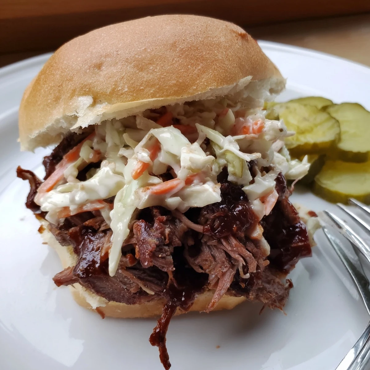Freshly shredded cabbage and carrot coleslaw add crunchy texture to these irresistible Beef Brisket Sliders served on toasted buns.