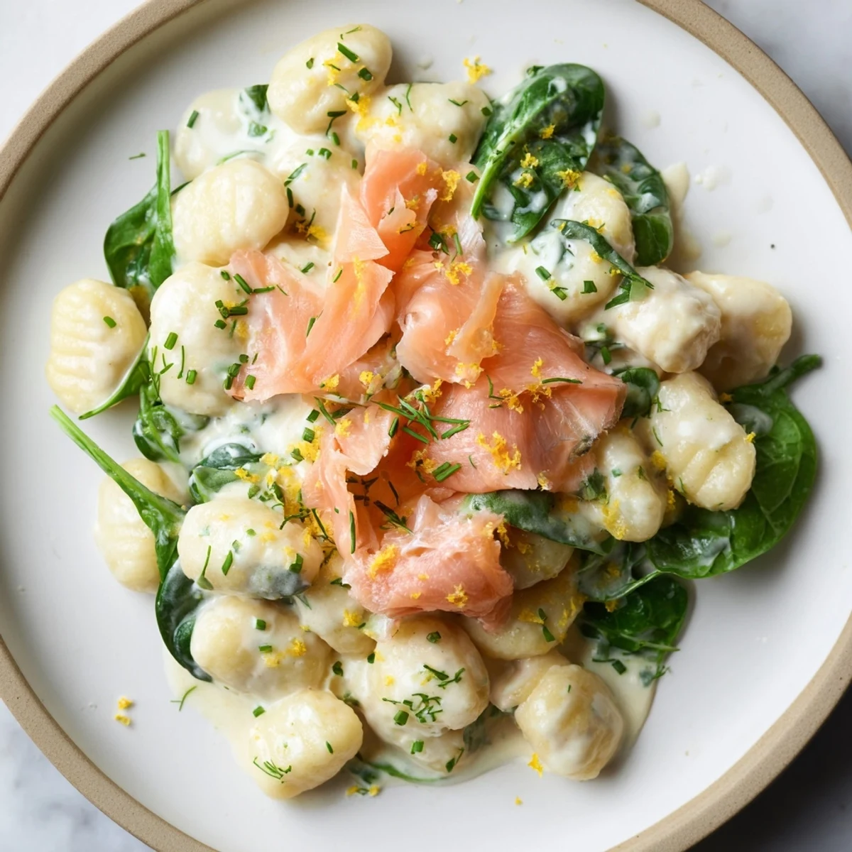 Pillowy Healthy Smoked Salmon Gnocchi tossed in a light sauce with smoked salmon strips.