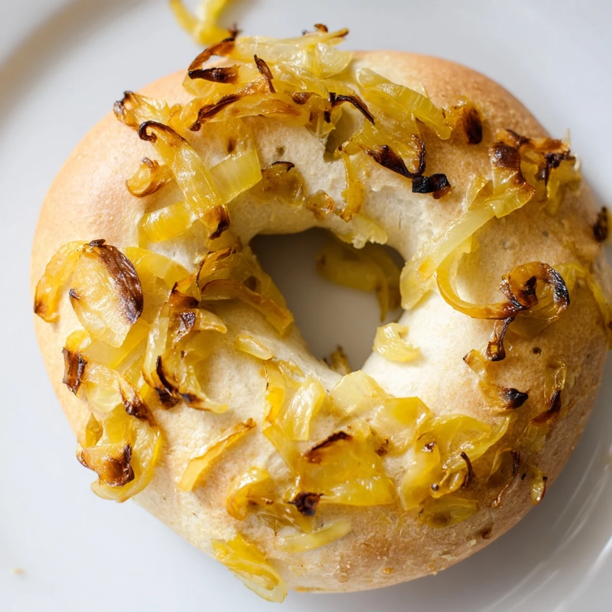 Warm sourdough onion bagels with sweet onions, ready to serve for an American breakfast.