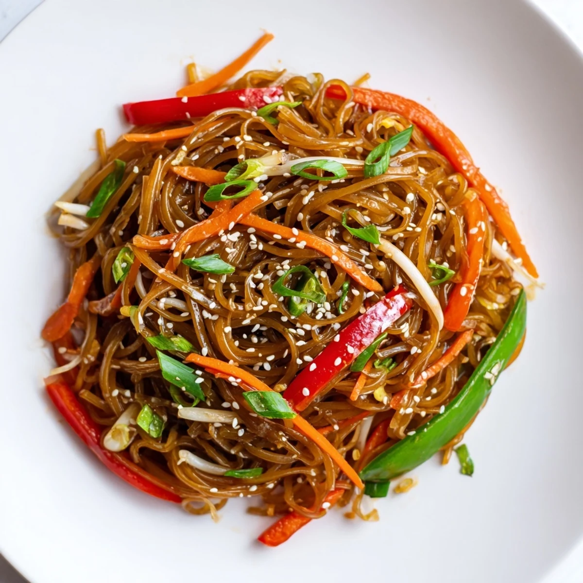 Colorful Rice Noodle Stir Fry with crisp vegetables in a glossy savory sauce.