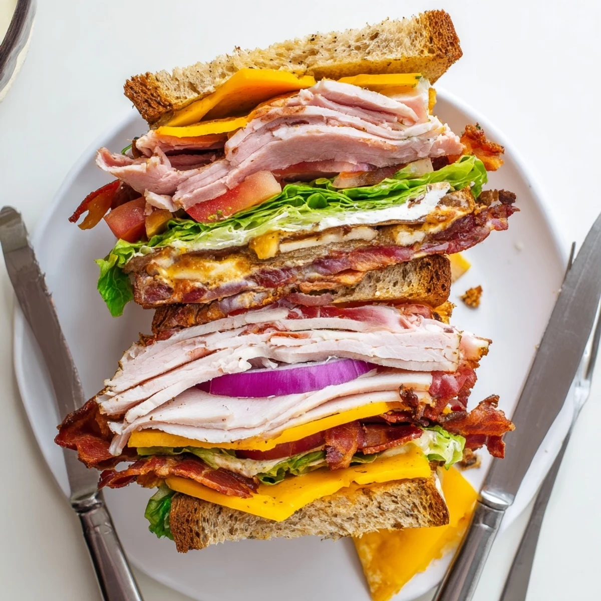 Golden toasted turkey beef bacon ranch sandwich stacked high with melted cheese and crisp vegetables