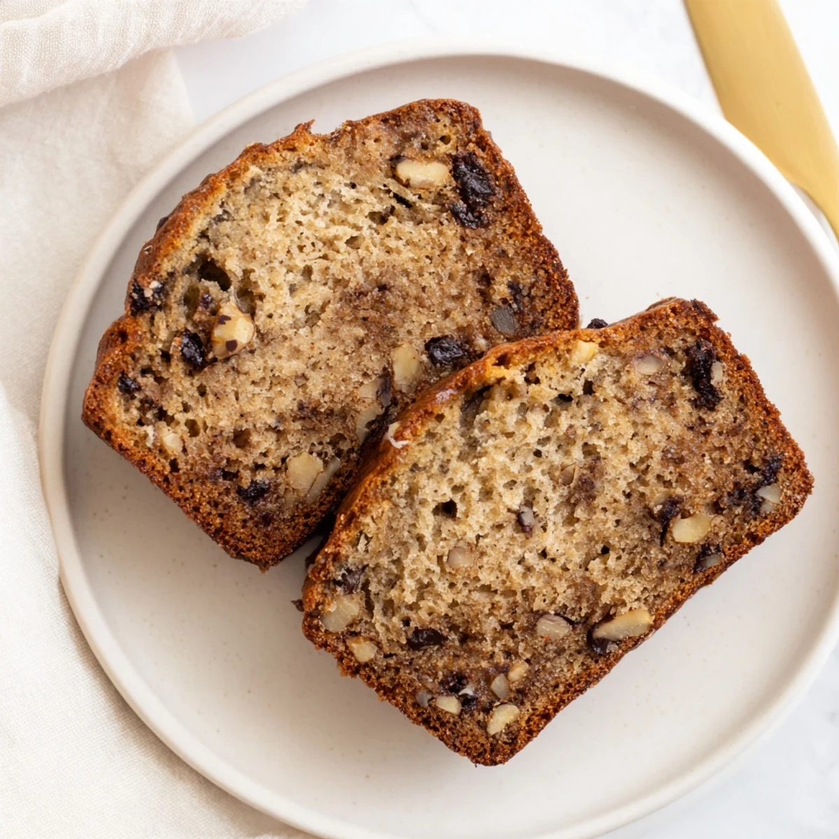Tender homemade banana bread loaf featuring sour cream for extra moisture and rich flavor