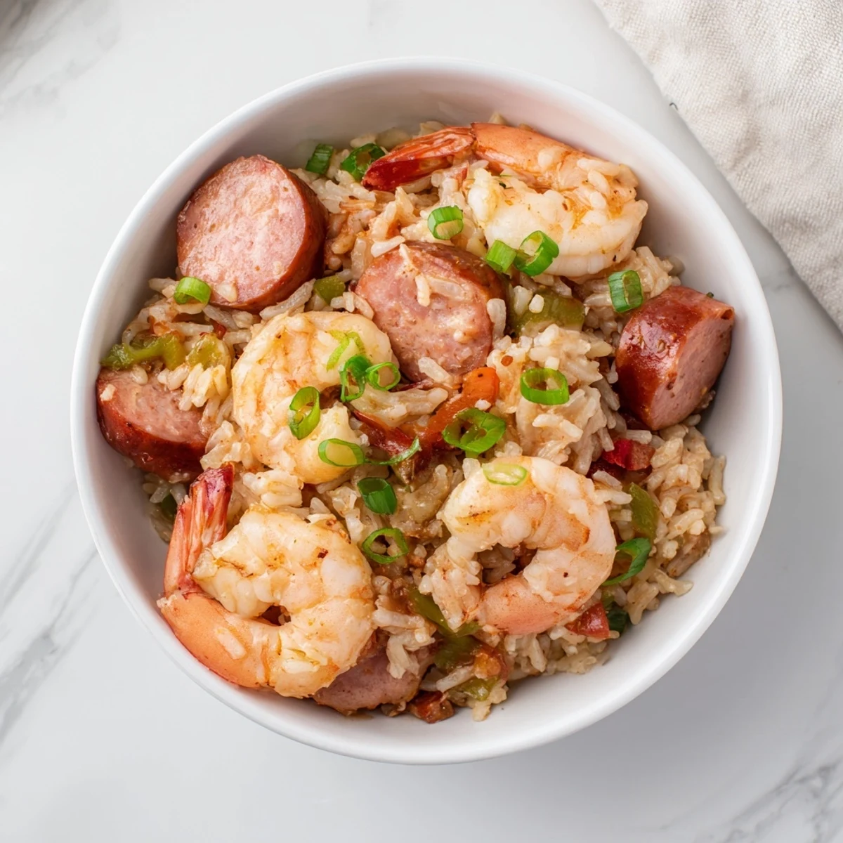 Golden One Pot Cajun Jambalaya with succulent shrimp, andouille sausage, and chicken piled high