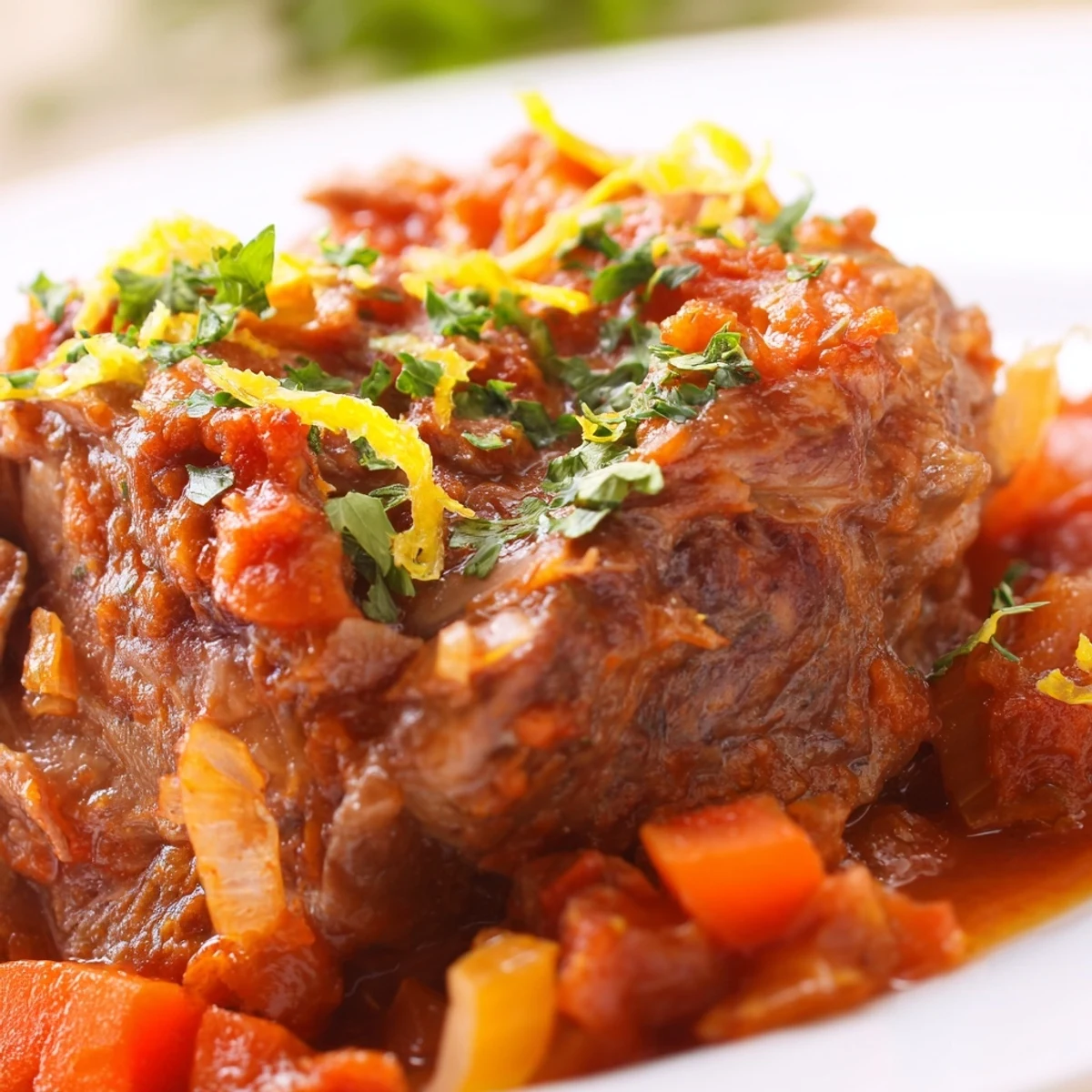 Osso Buco à la Ina Garten served over creamy risotto with fresh gremolata and aromatic vegetables