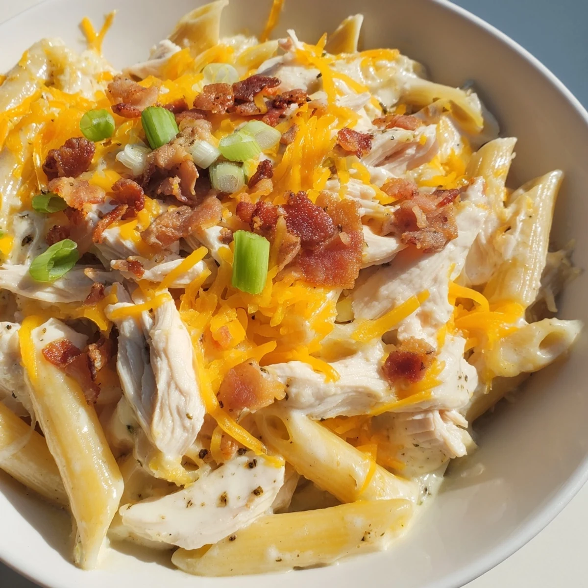 Rich cheesy chicken pasta dish loaded with bacon and tender shredded chicken
