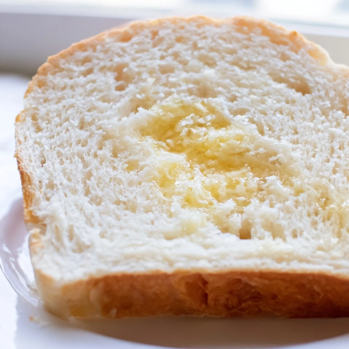 Sliced homemade Amish white bread showing soft tender texture ideal for toasting and sandwiches
