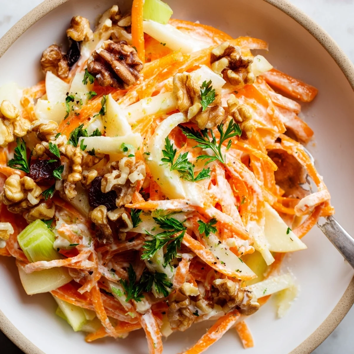 Crunchy Apple Carrot Salad With Creamy Citrus Dressing, crisp apples and toasted nuts.
